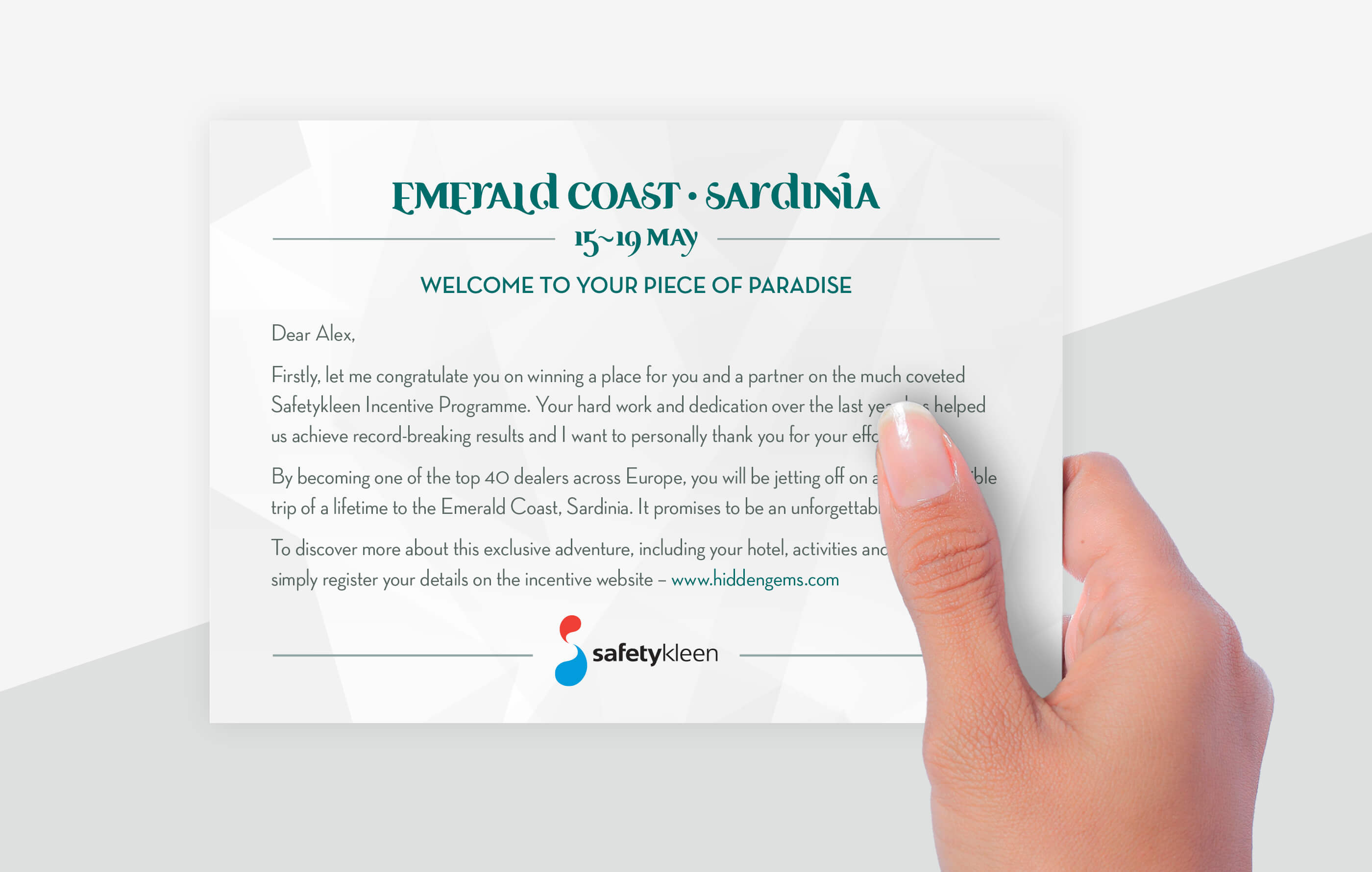 Female hand holding a Hidden Gems winners card, which contratulates them for securing a place on the much coveted incentive trip to the Emerald Coast, Sardinia and invites them to visit a website for further details