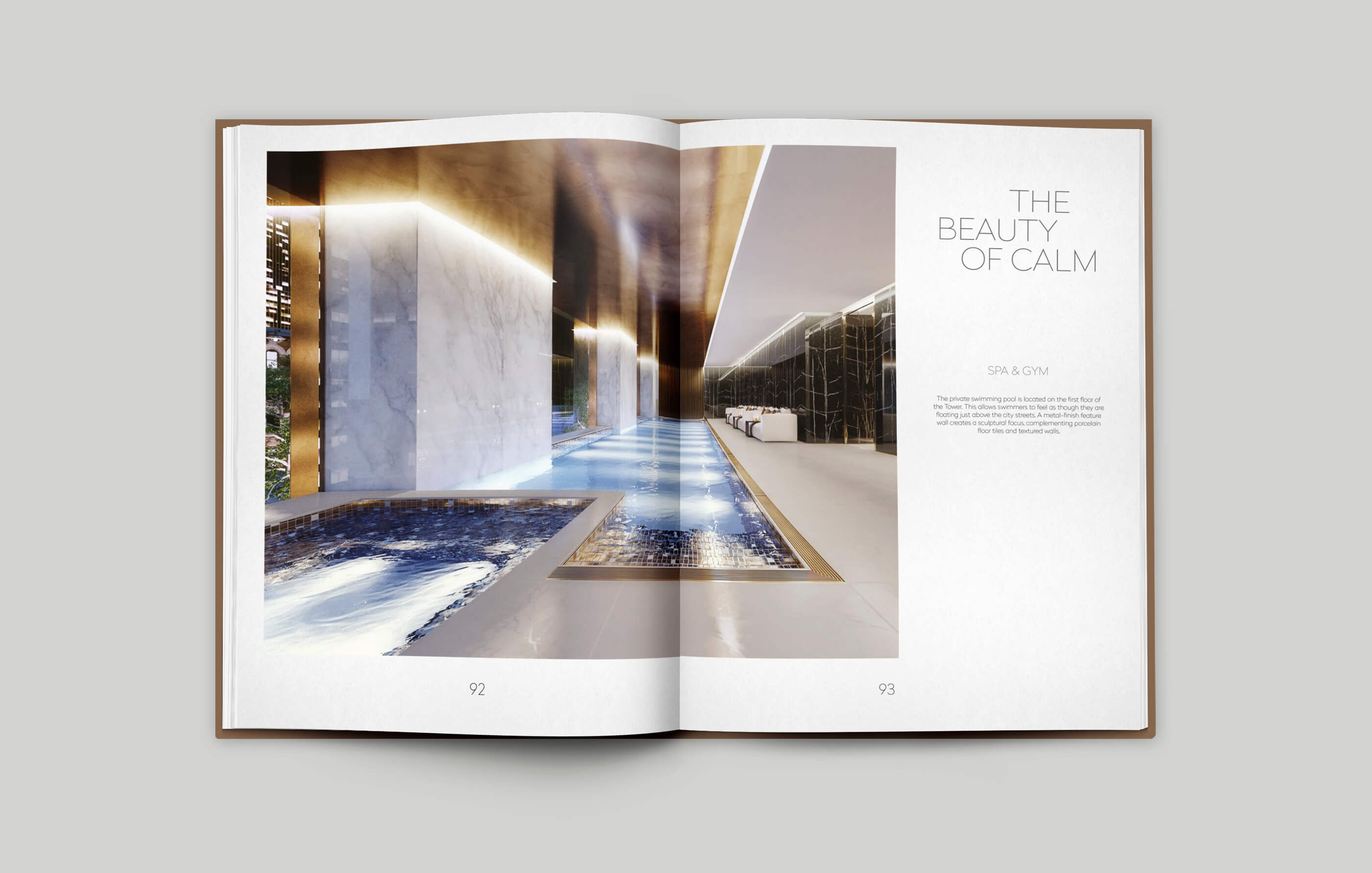 Open brochure spread on a grey background, showing the spa, pool and gym complex inside Principal Tower