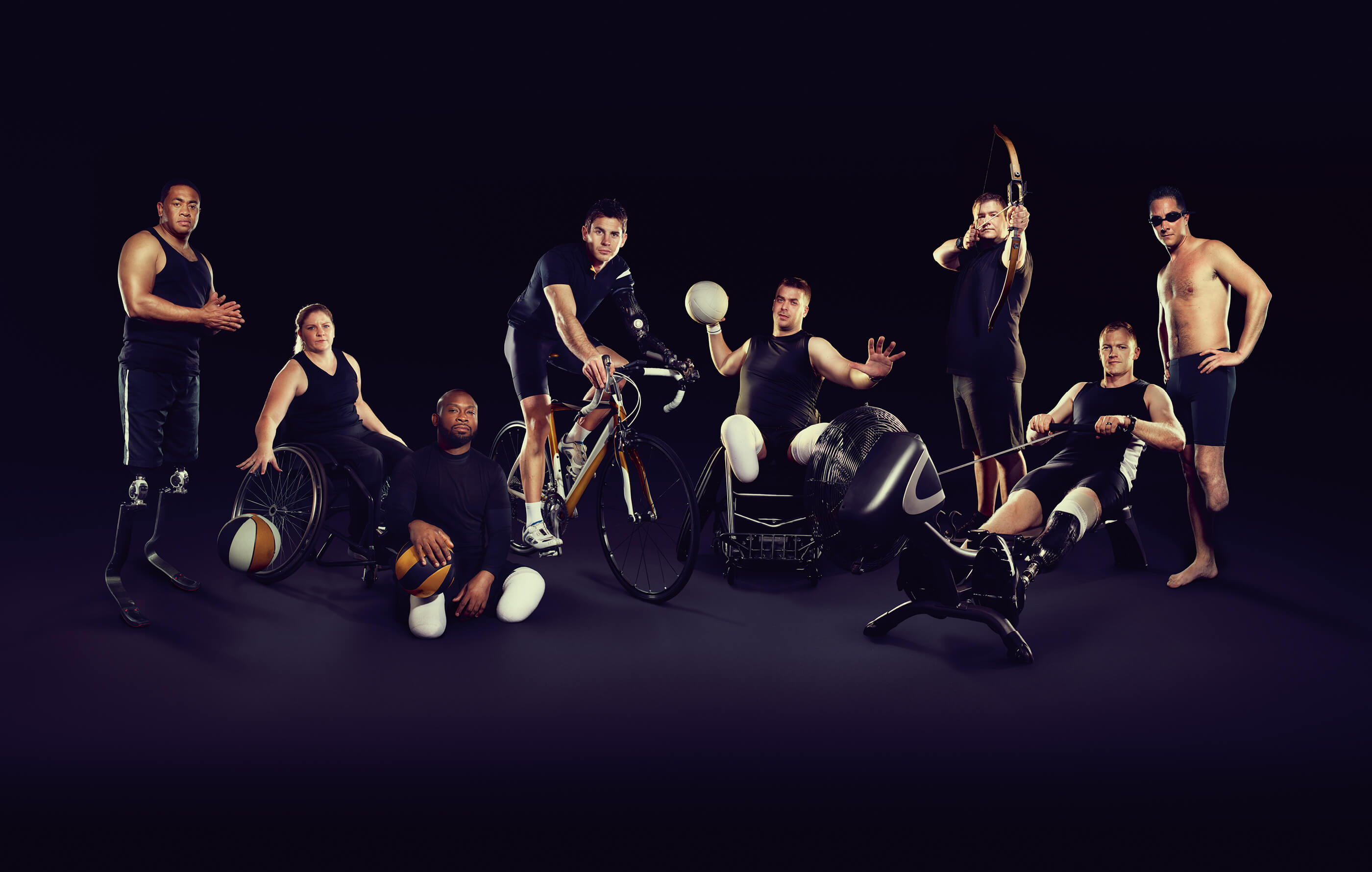 Full screen image of the Invictus Games participants from 8 sport disciplines – including running, basketball, archery and cycling – on a black background