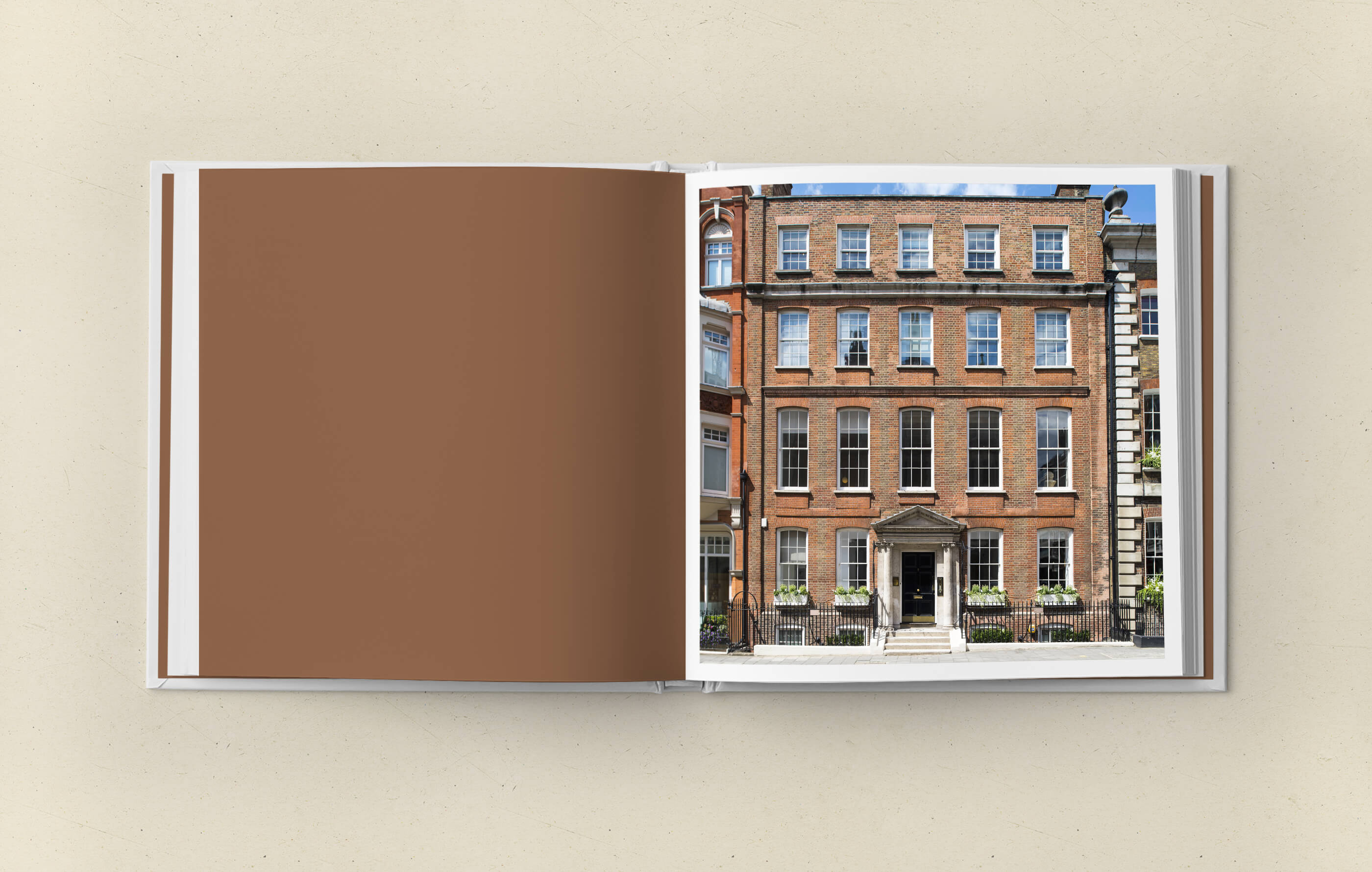 Open brochure spread on a beige background featuring a front view photograph of 9 Clifford Street, with its 4 floors and basement level