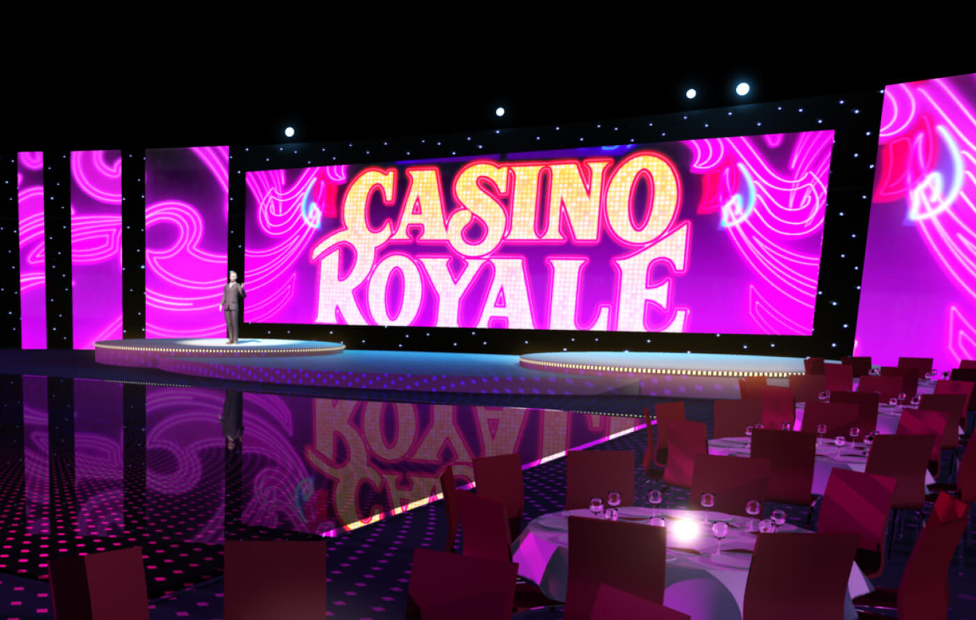 3D render of the Casino Royale animated backdrop, behind a presenter on stage in a dimly lit room