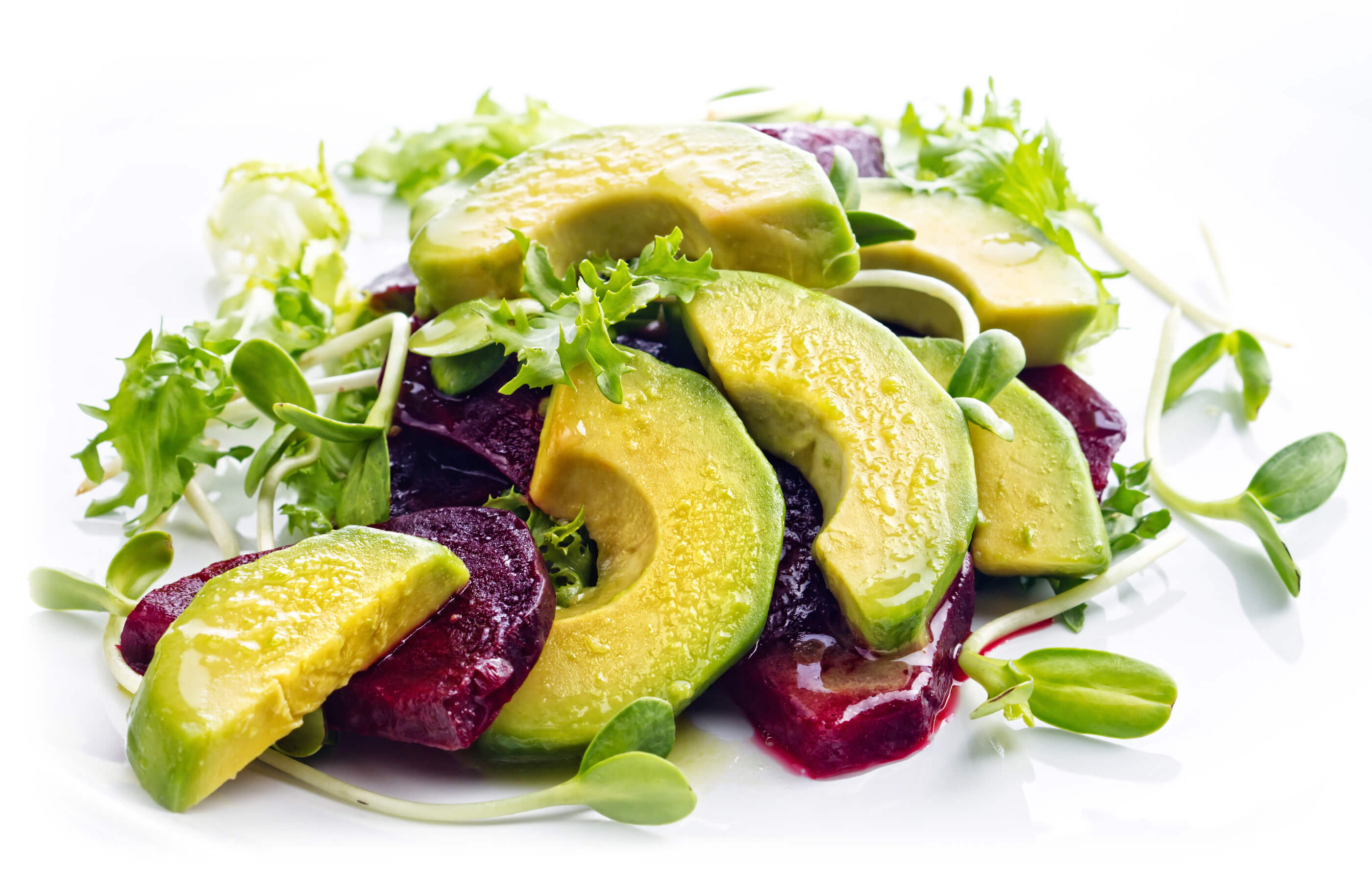 Full spread image of an avocado and beetroot salad, with watercress and olive oil dressing