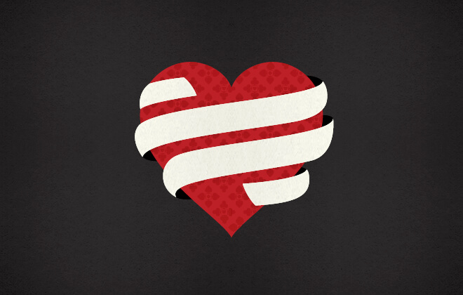 Red heart shape wrapped in a beige ribbon on a black textured background