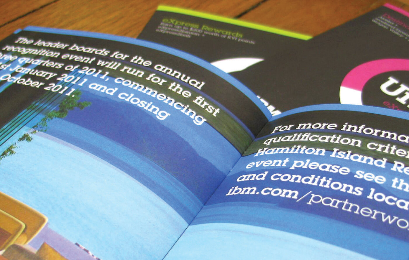 Front covers and an inside spread of the branded IBM Unltd printed collateral